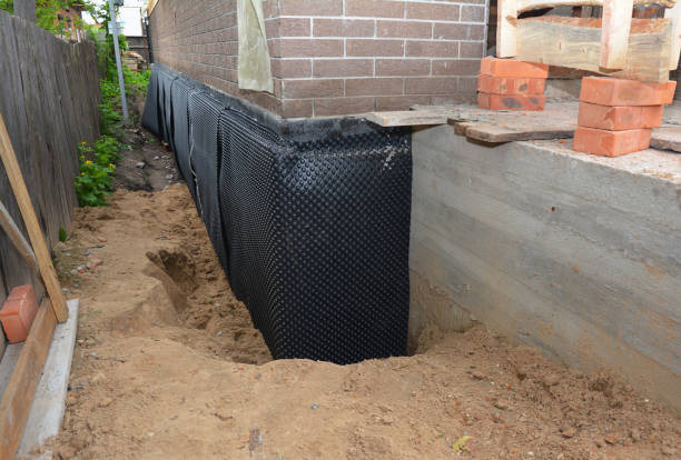Happy homeowners after waterproofing job in Friendship